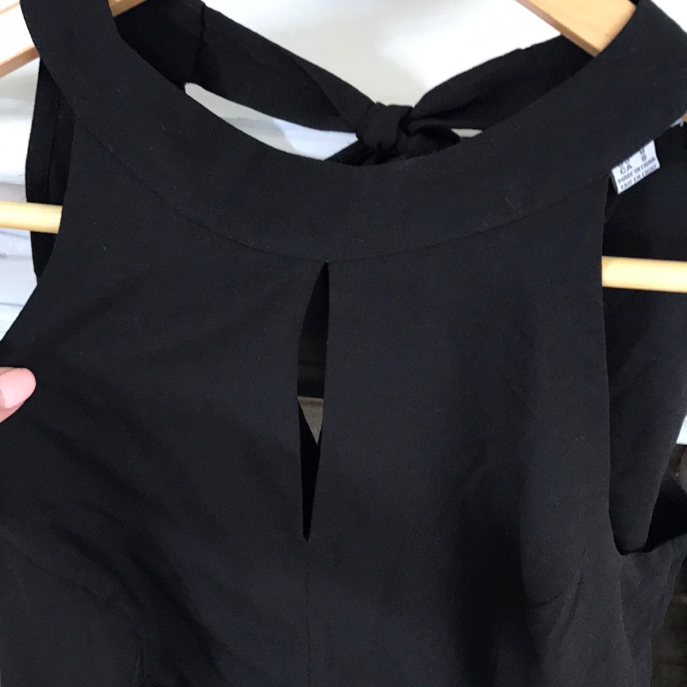 Black, cropped, halter Jumpsuit.